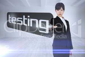 Businesswoman pointing to word testing