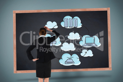 Composite image of young businesswoman standing and thinking