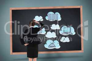 Composite image of young businesswoman standing and thinking