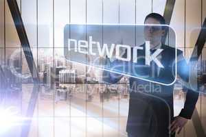 Businessman presenting the word network