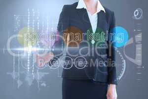Businesswoman touching the words social marketing on interface