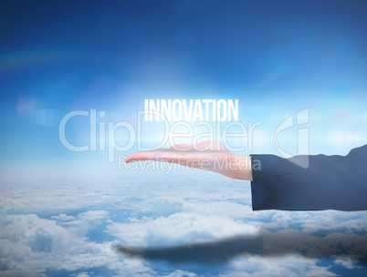 Businesswomans hand presenting the word innovation
