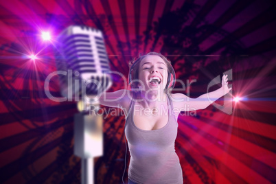 Composite image of pretty girl listening to music