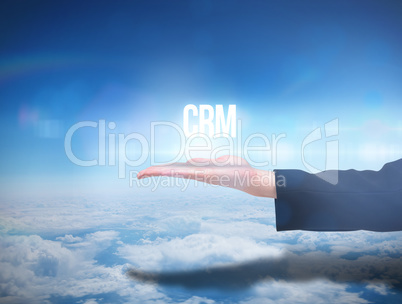 Businesswomans hand presenting the word crm