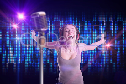 Composite image of pretty girl listening to music