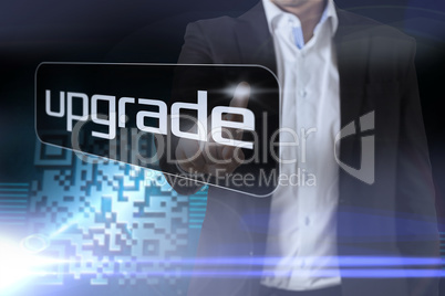 Businessman pointing to word upgrade