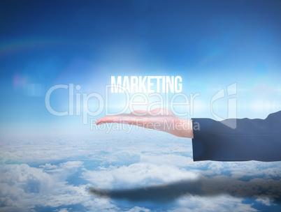 Businesswomans hand presenting the word marketing