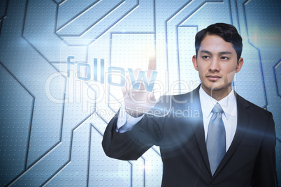 Businessman pointing to word follow