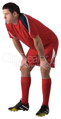 Tired football player bending over