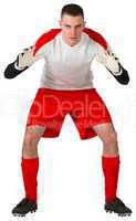 Goalkeeper in red and white ready to catch