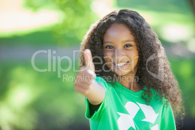 Young environmental activist smiling at the camera showing thumb