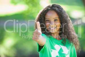 Young environmental activist smiling at the camera showing thumb
