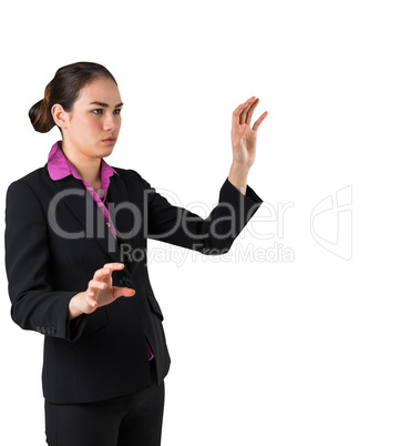 Serious businesswoman in suit gesturing with hands