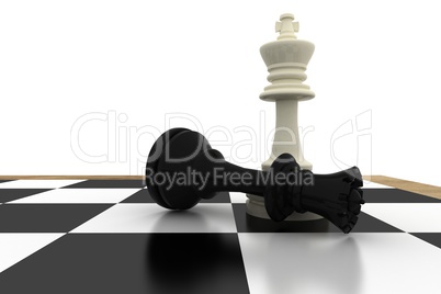 White king standing over fallen black queen