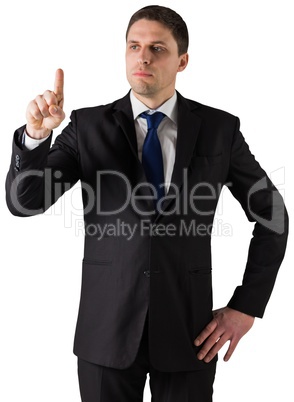 Handsome businessman standing and pointing