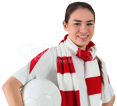 Smiling football fan in white holding ball