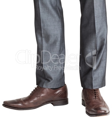 Businessmans feet in brown brogues