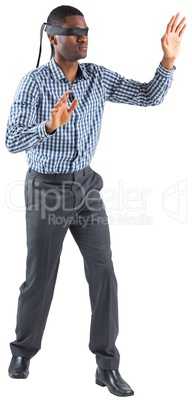 Blindfolded businessman with arms out