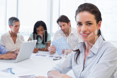 Attractive businesswoman smiling in the workplace