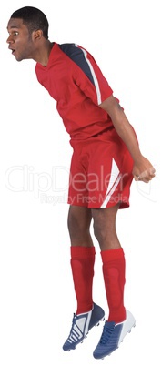 Football player in red jumping