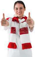 Football fan in white wearing scarf showing thumbs up