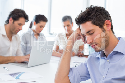 Attractive businessman resting at work