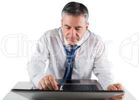 Mature businessman running diagnostics on laptop