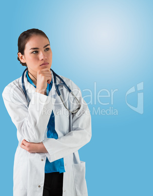 Serious doctor in lab coat thinking with hand on chin