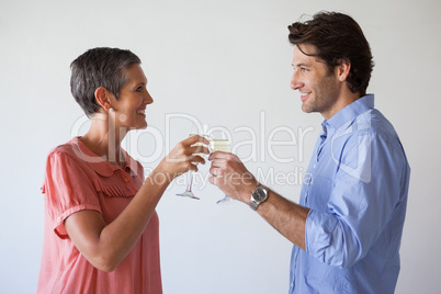 Casual successful business team toasting with champagne