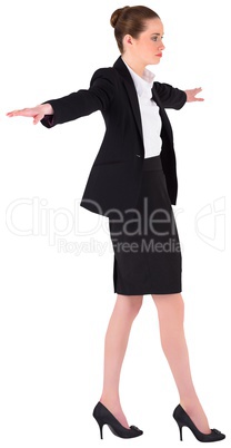 Businesswoman performing a balancing act