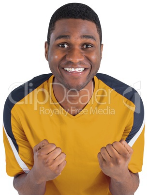 Cheering football fan in yellow jersey