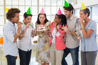 Workers celebrating a birthday together