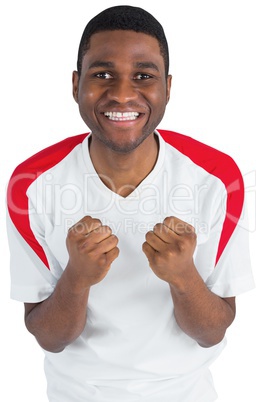 Excited football fan in white cheering