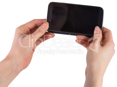 Hands holding smartphone showing screen