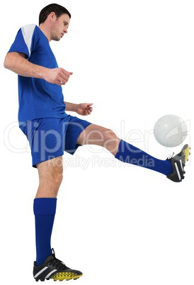 Football player in blue kicking