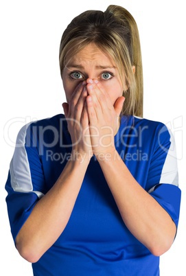 Nervous football fan in blue jersey