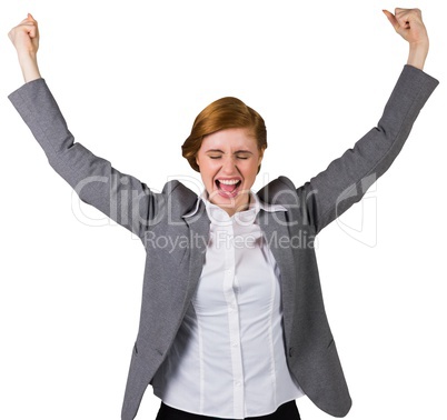 Excited redhead businesswoman cheering