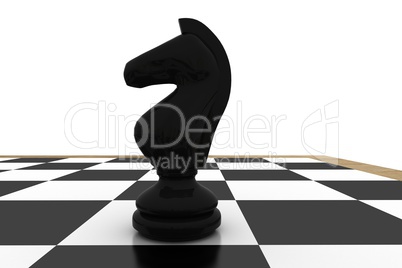 Black knight on chess board