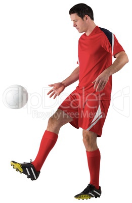 Football player in red kicking