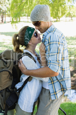 Active cute couple embracing each other on a hike