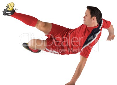 Football player in red kicking