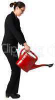 Businesswoman using red watering can
