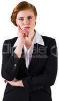 Thinking redhead businesswoman in suit