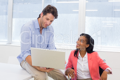 Coworkers discussing work together