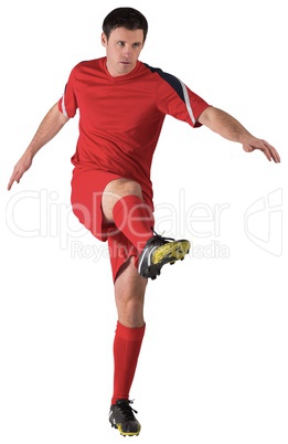 Football player in red kicking