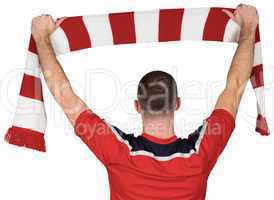 Football player holding striped scarf