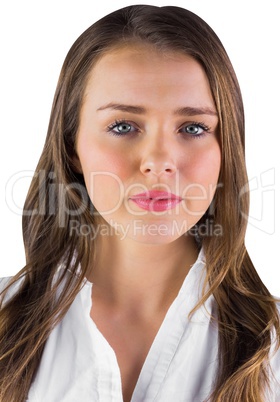 Serious young woman in white shirt