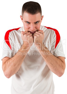 Nervous football player looking at camera