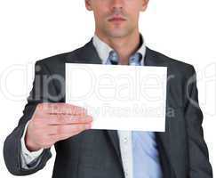 Businessman in grey suit showing card