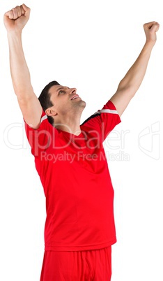 Excited young football player cheering